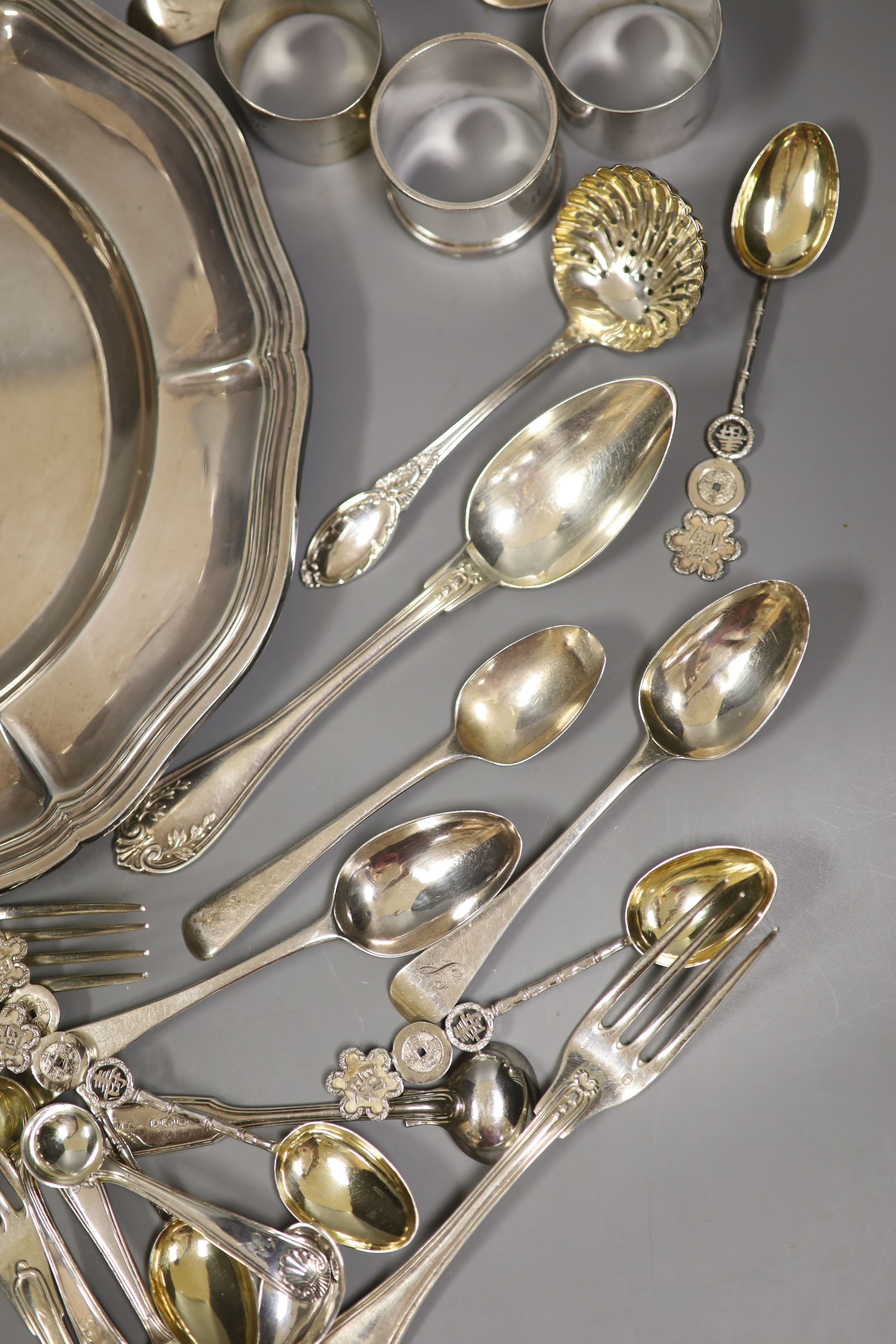 A group of assorted flatware, including some French and Chinese white metal and English silver and an Odiot 1885 white metal plate